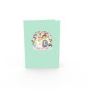 Newlyweds under floral arch Pop-Up Card